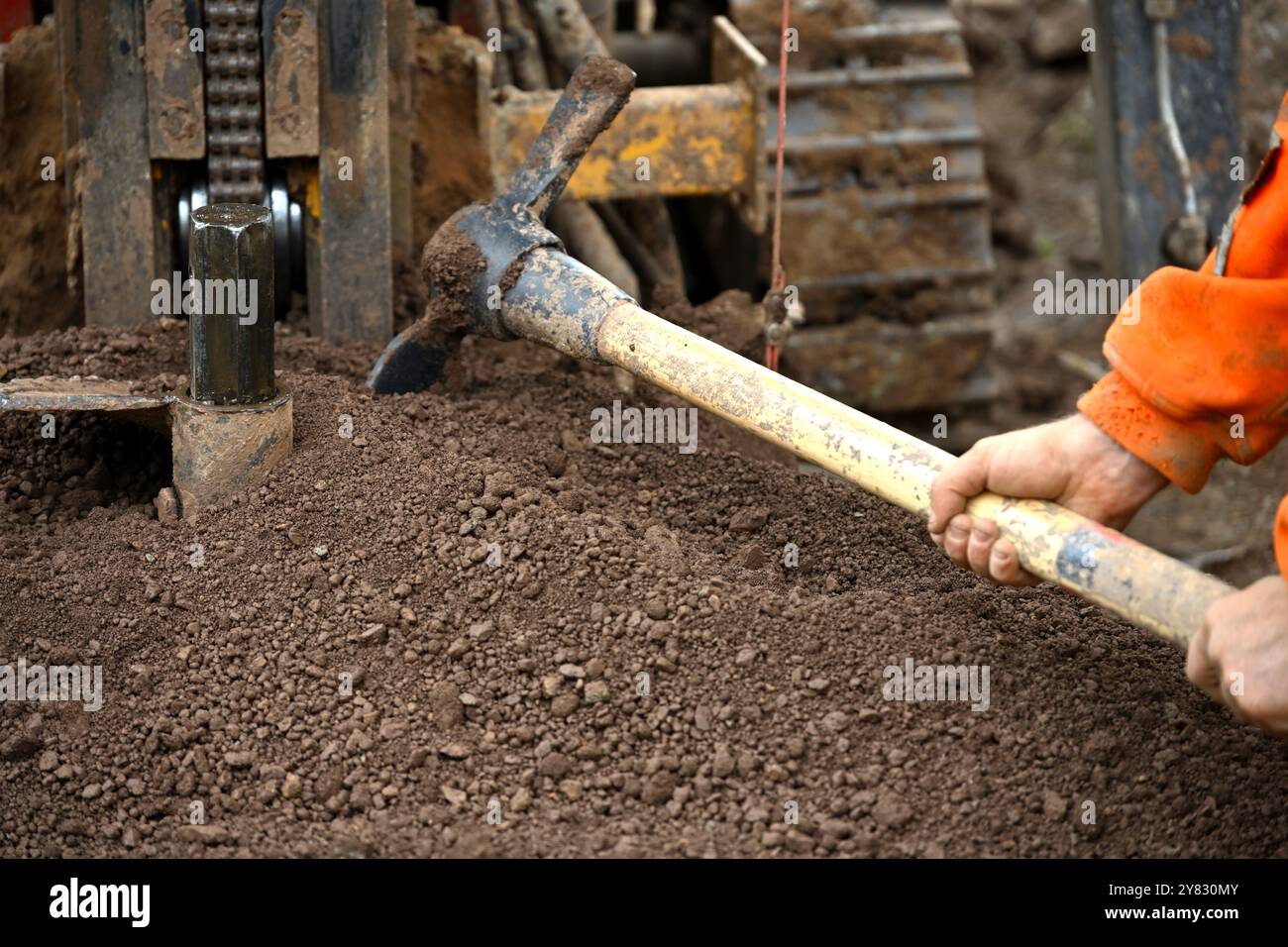 Matick Digging Mattock being used to move soil from an auger drilling site Stock Photo ...
