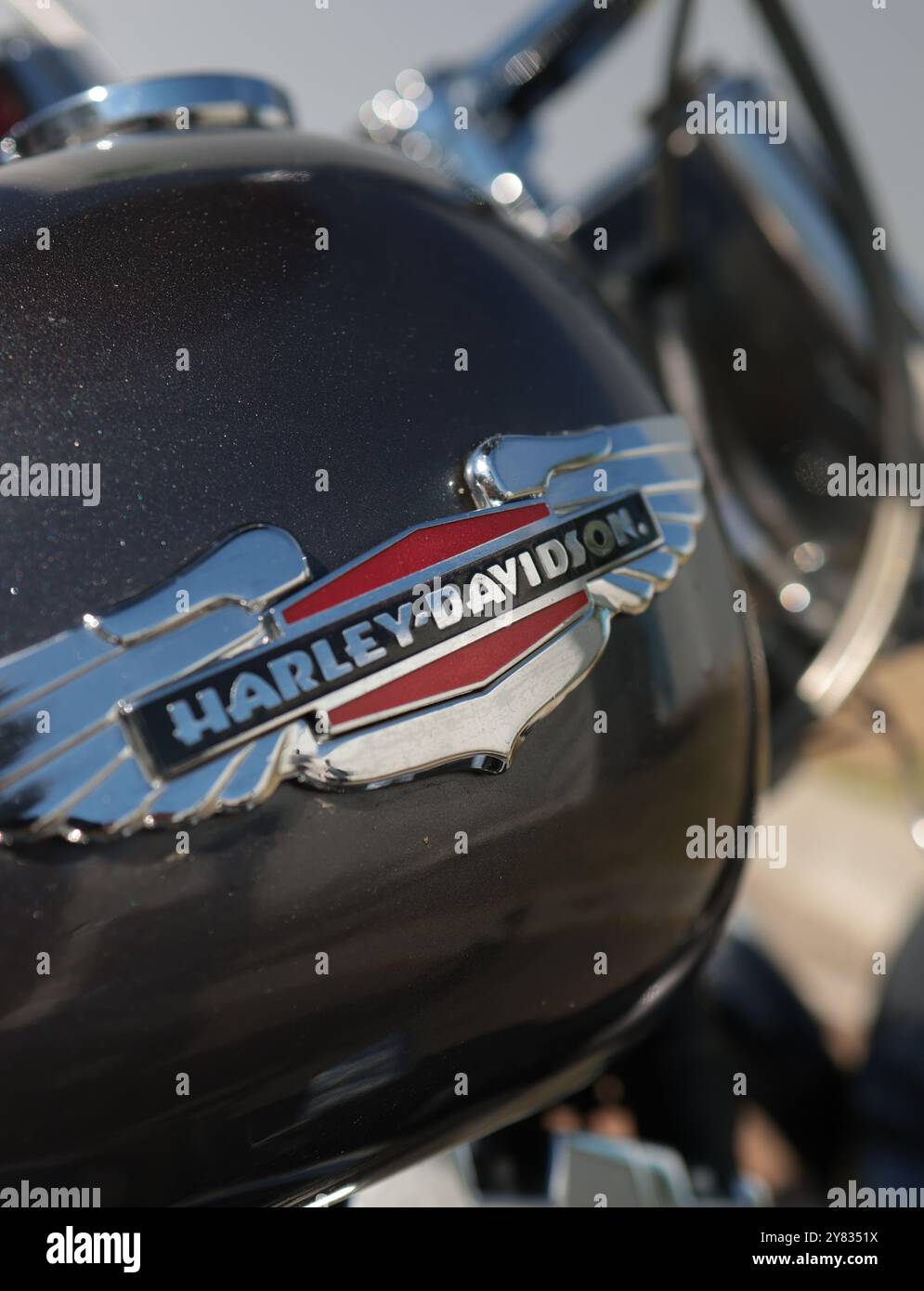 Bucharest, Romania - October 2, 2024: Shallow depth of field (selective focus) details with the Harley Davidson logo on a motorcycle. Stock Photo
