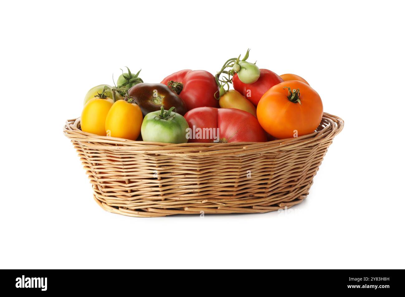 Different ripe tomatoes in basket on white background Stock Photo - Alamy