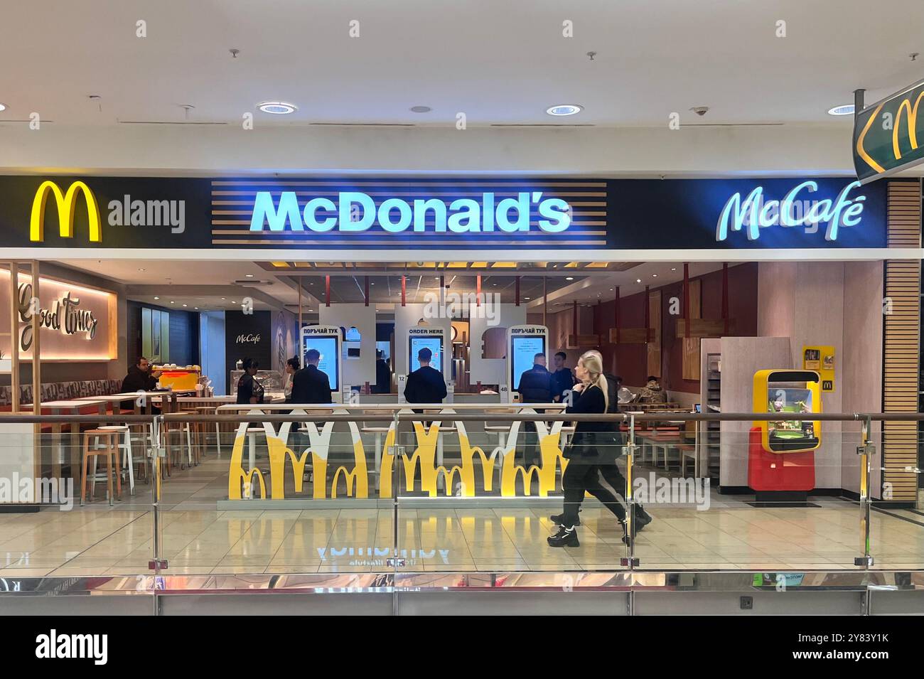 McDonald's and McCafe fast food restaurant interior in a shopping mall centre in Sofia Bulgaria, Eastern Europe, Balkans, EU - Smartphone Captured Stock Image