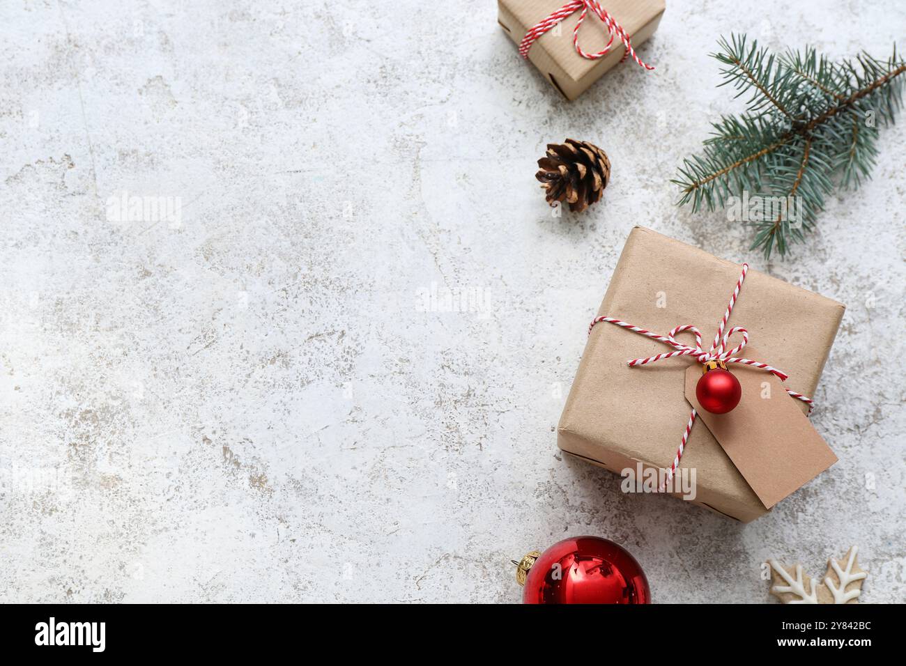 Christmas tree branch and gift boxes on white background Stock Photo ...