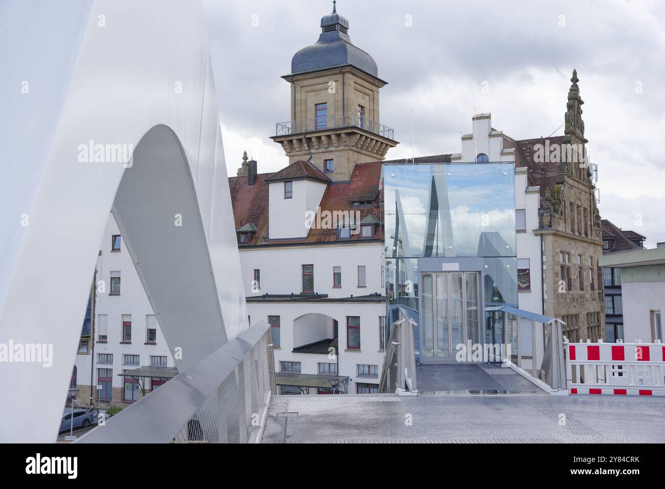 View from the station bridge to the lift and the old post office, main station neo-renaissance, glass facade, reflection, Heilbronn, Neckar valley, Ne Stock Photo