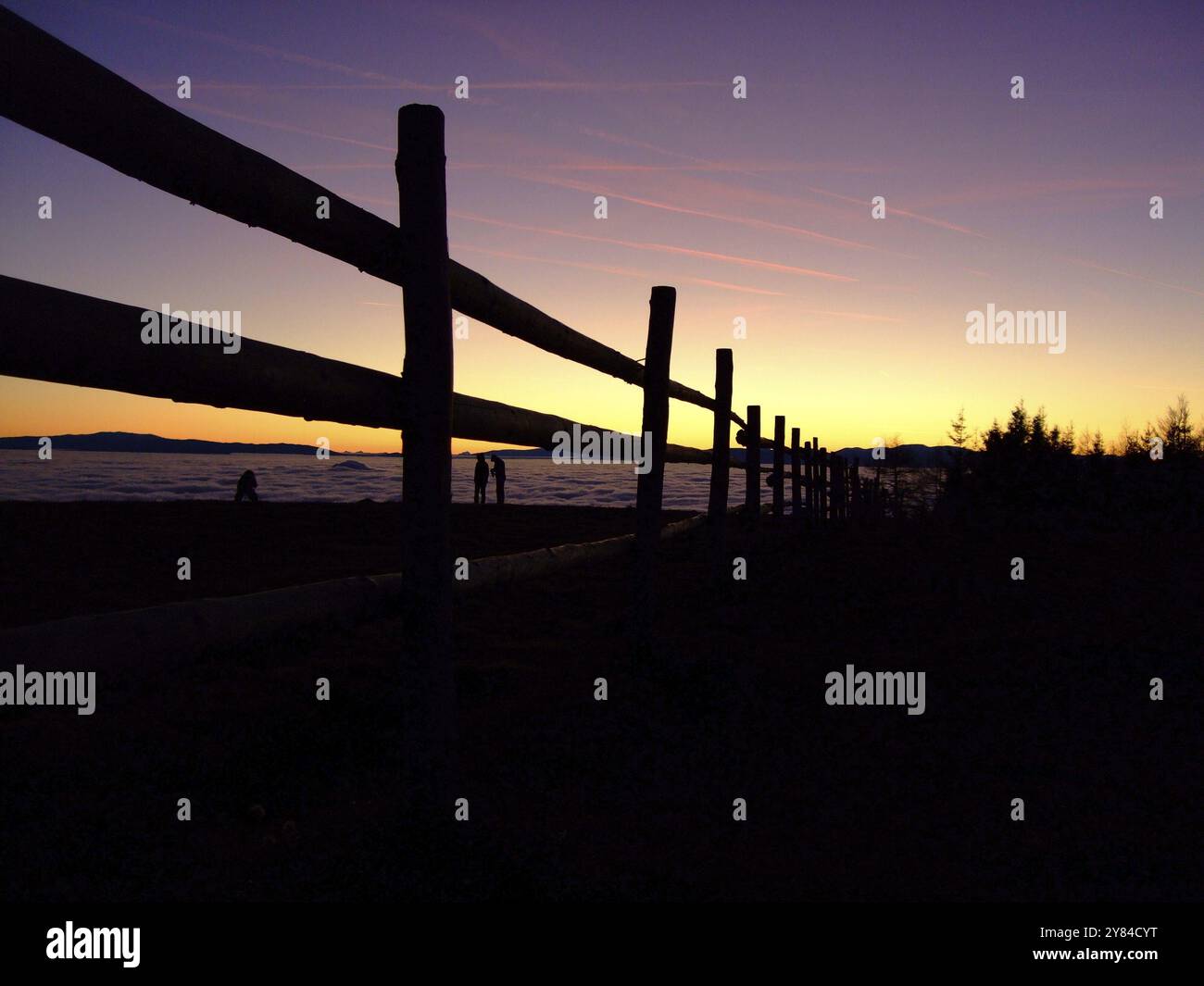 Fence in front of sunset Stock Photo - Alamy