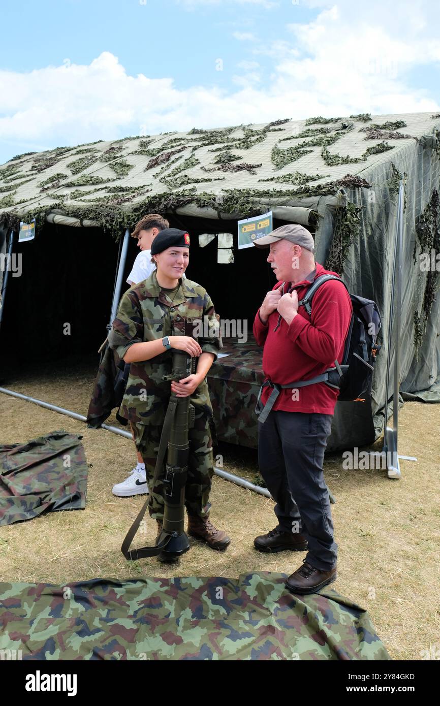 2024 Bray Air Display, Bray, County Wicklow, Ireland; spectator speaking with a member of the Irish Defence Forces; female soldier. Stock Photo