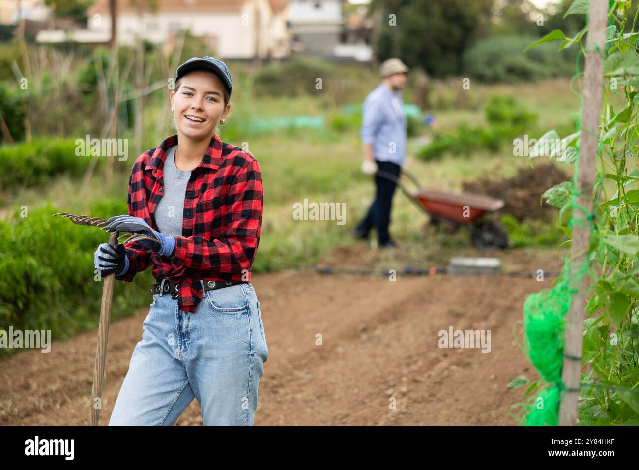 Farmer holding rake hi-res stock photography and images - Alamy