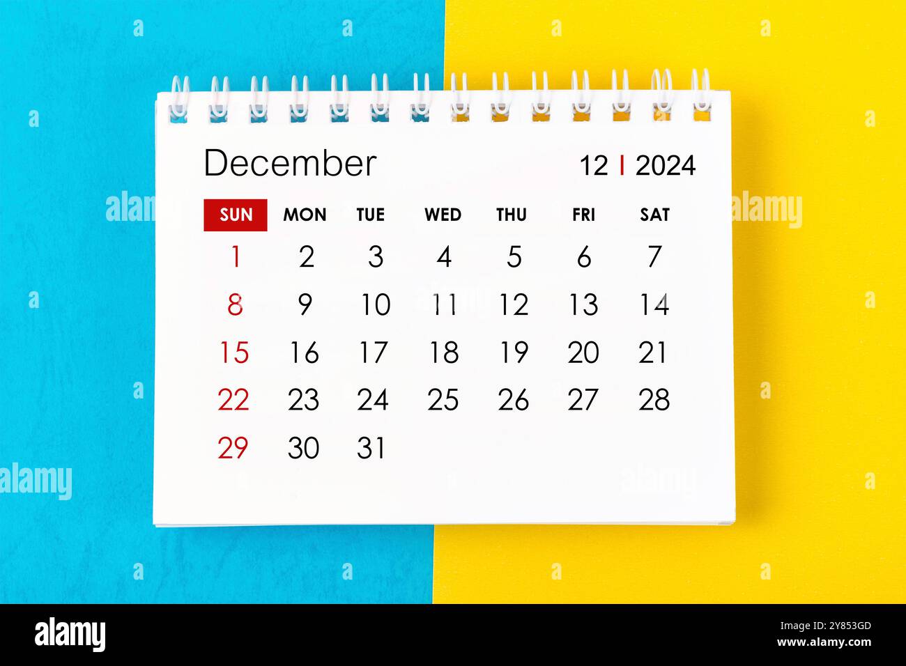December 2024 Monthly desk calendar for 2024 year on blue and yellow ...
