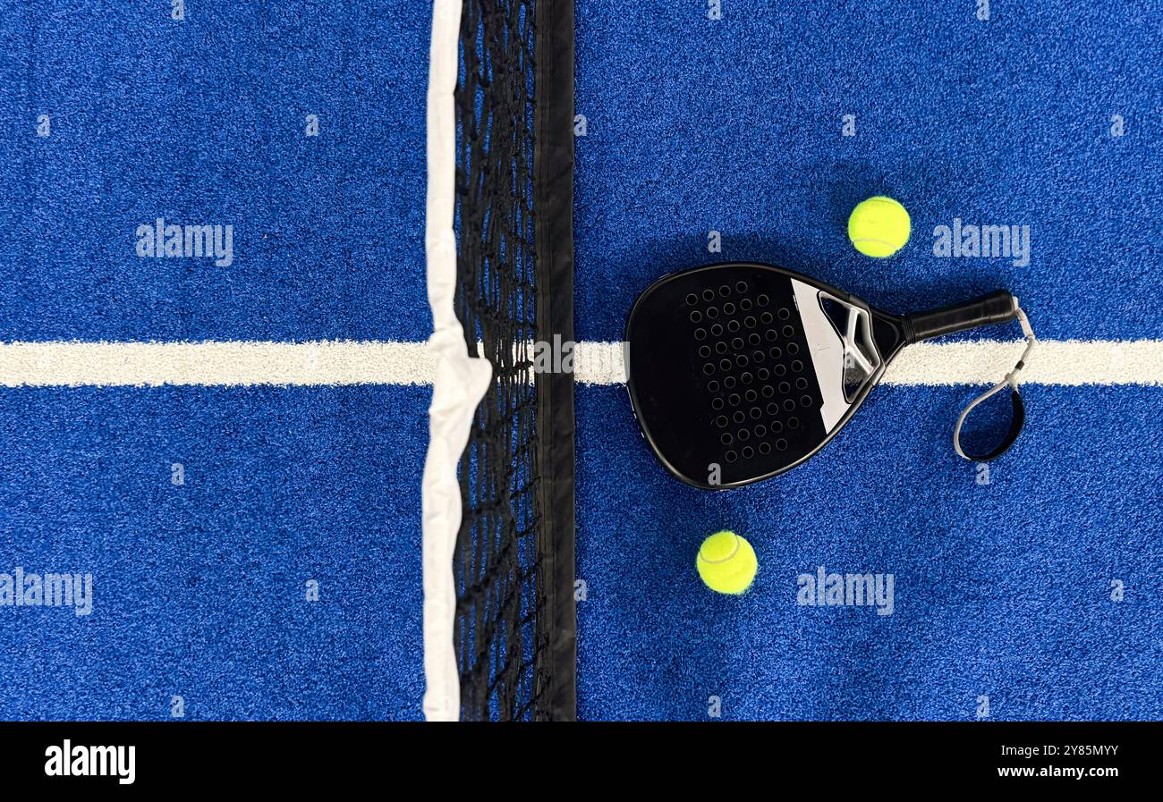 Padel Racket Photo Blue Court padel racket on a padel blue court with a ball Stock Photo - Alamy