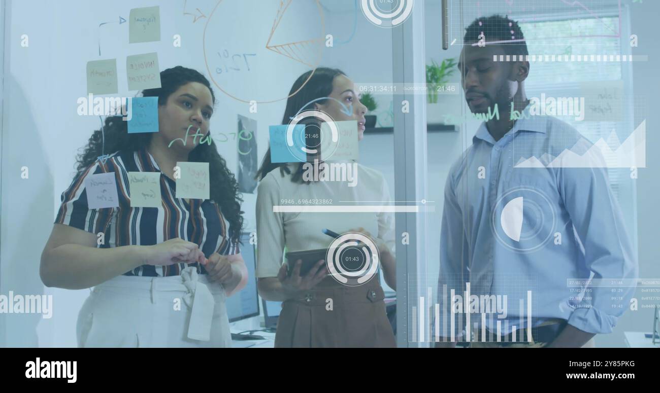 Business analytics and data visualization image over diverse team discussing in office Stock Photo