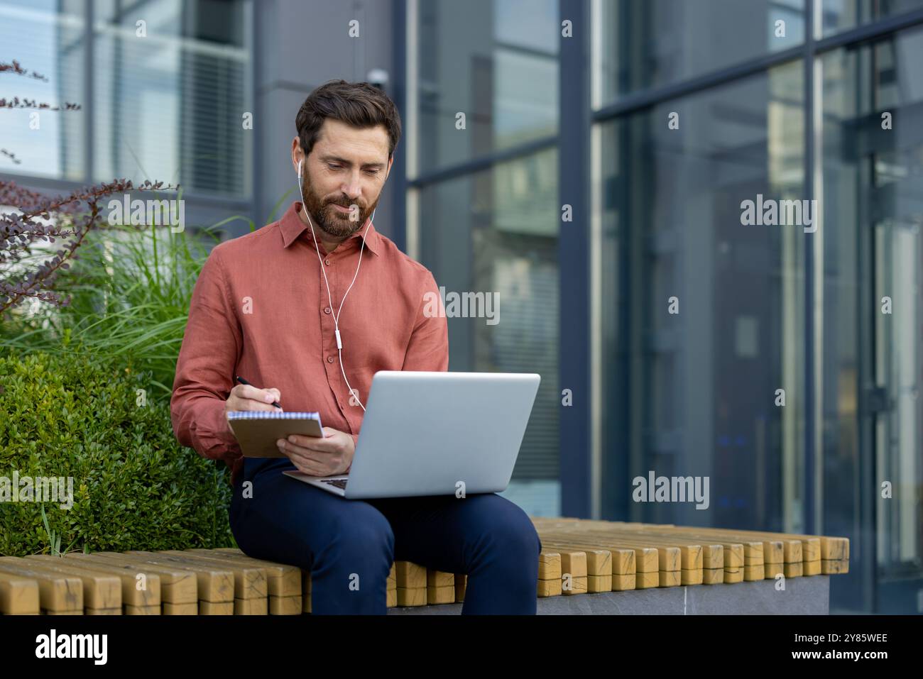 Person wearing orange shirt hi-res stock photography and images - Alamy