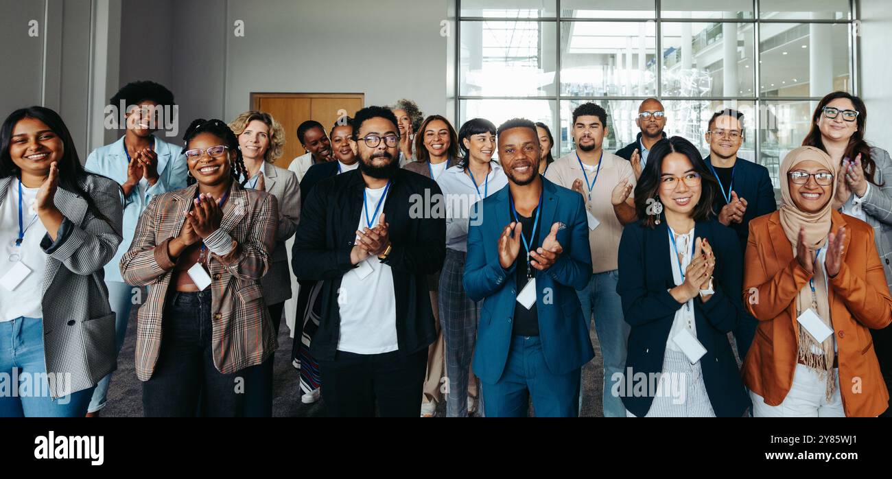 Multicultural audience clapping hi-res stock photography and images - Alamy