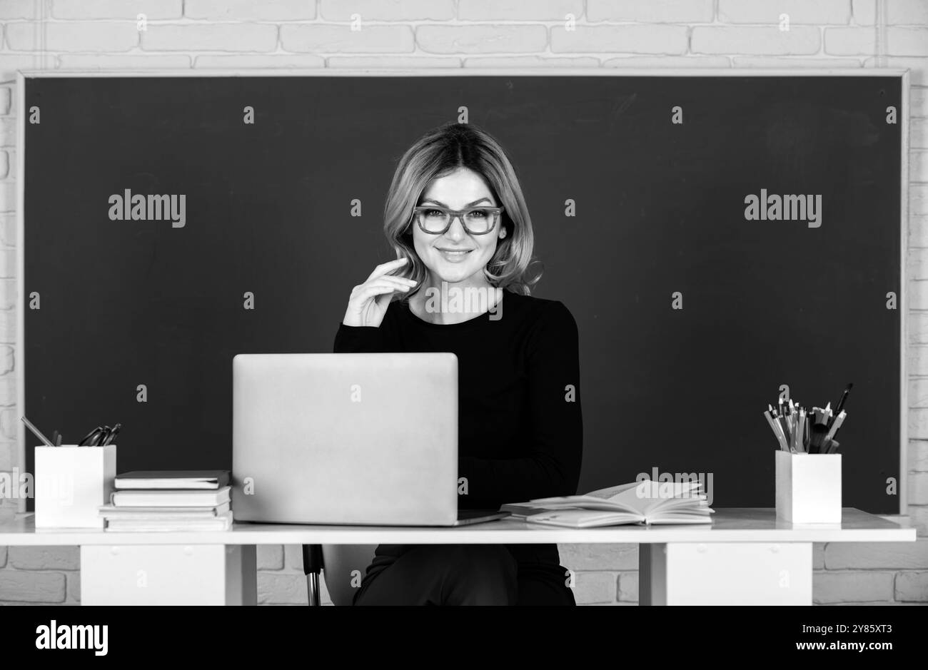 Portrait Of Female Teacher Is Teaching Online Through Webcam Students Portrait of female teacher is teaching online through webcam students
