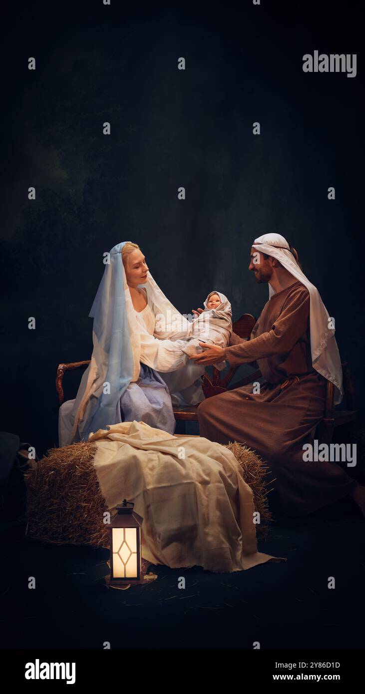 Holy and magical nativity scene with Mary gently holding baby Jesus ...