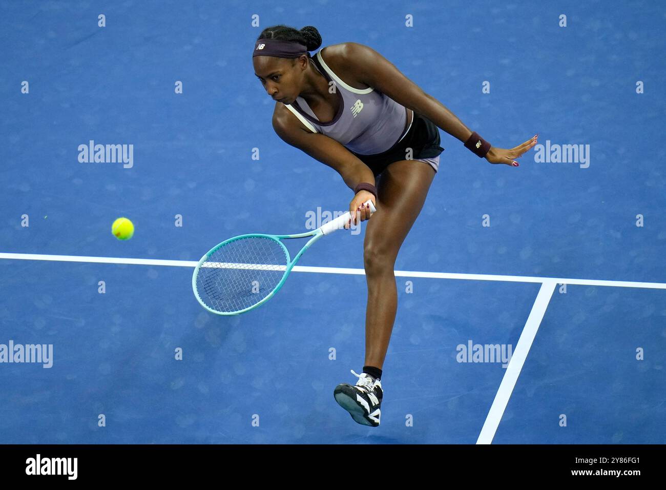 Coco Gauff of the United States returns a forehand shot to Yuliia