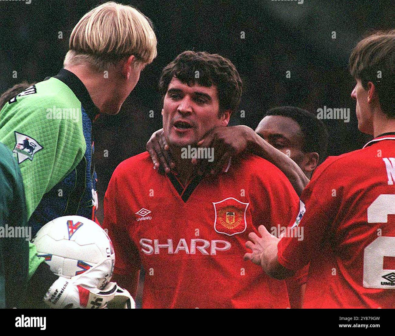 Roy Keane of Manchester United is restrained by Paul Parker and Gary ...