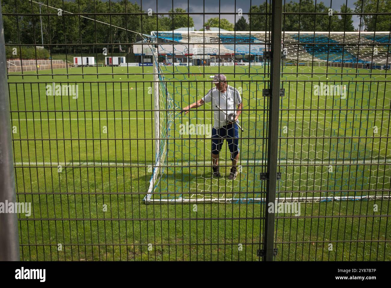 The groundsman checking the nets before SV Tasmania Berlin play Hansa Rostock II in a NOFV-Oberliga Nord fixture at the Werner-Seelenbinder-Sportpark. Stock Photo