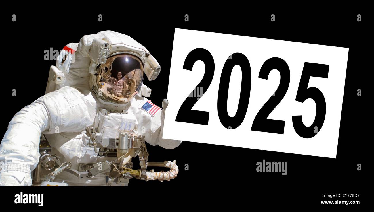 Astronaut in space holding a 2025 white  board - elements of this image are provided by NASA Stock Photo