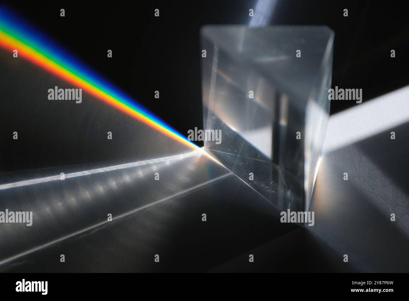 prism glass dispersion of white light to spectrum Stock Photo