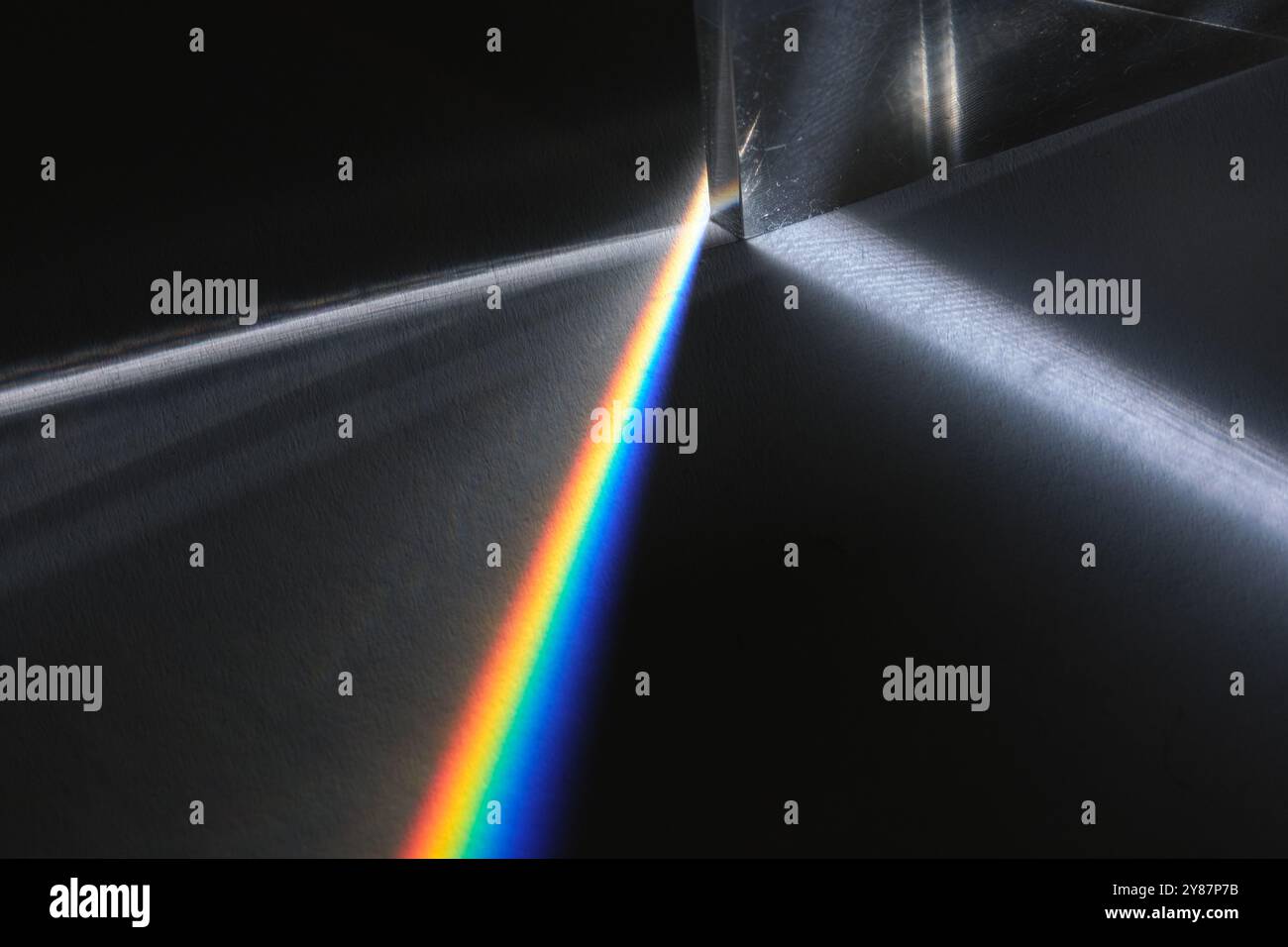 prism glass dispersion of white light to spectrum Stock Photo