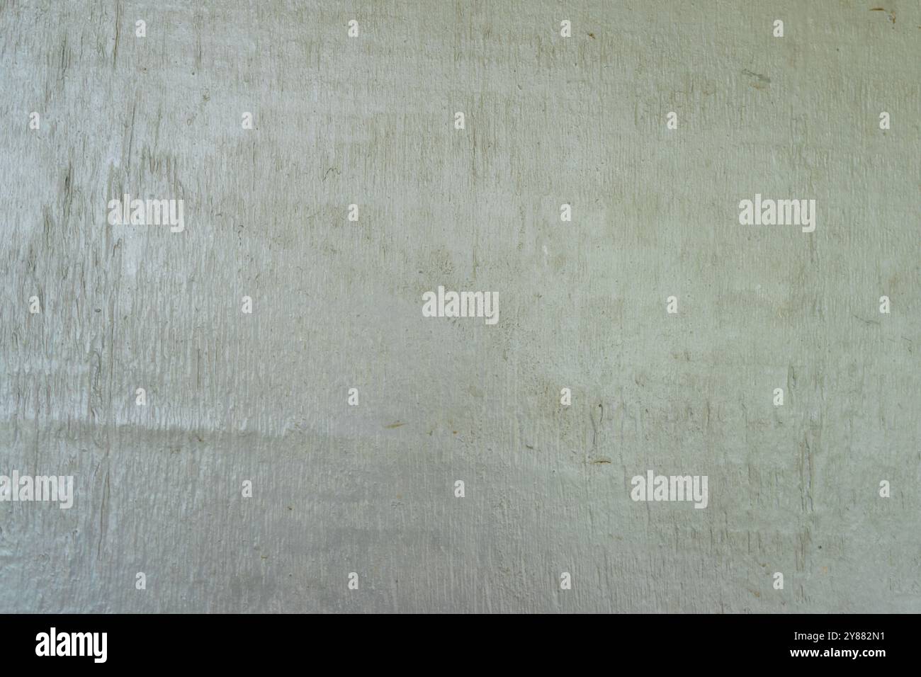 Subtle variations of light on a textured neutral wall Stock Photo - Alamy