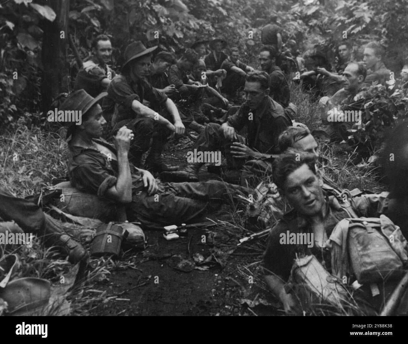 A breather on the track. Australian troops who pursued the enemy along ...