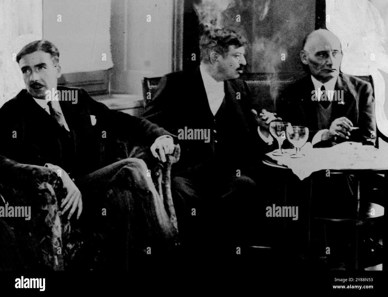 Principals at Geneva Conference -- (left to right) Mr. Anthony Eden, M. Laval and Baron Aloisi photographed during an informal conference at Geneva on the Italian *****. October 11, 1935. Stock Photo