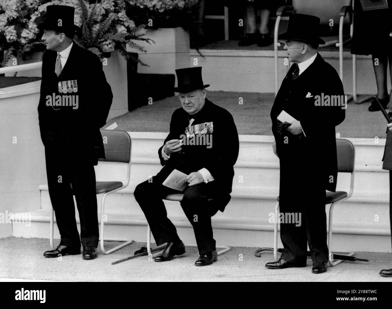 Victory Day -- An informal picture of, British Premier, Mr. Clement Attlee; Ex-Prime Minister, Mr. Winston Churchill and Canadian Premier, Mr. McKenzie king. made at the saluting base in the Mall, London, today June 08, During the March fast. More than 21, 000, men and women took past in the Giant Victory-Day March through London, today June 8. the hug parade, which covered more than 20 miles, included British and Allied Forces, as will as civilian workers. June 20, 1946. (Photo by Associated Press Photo). Stock Photo