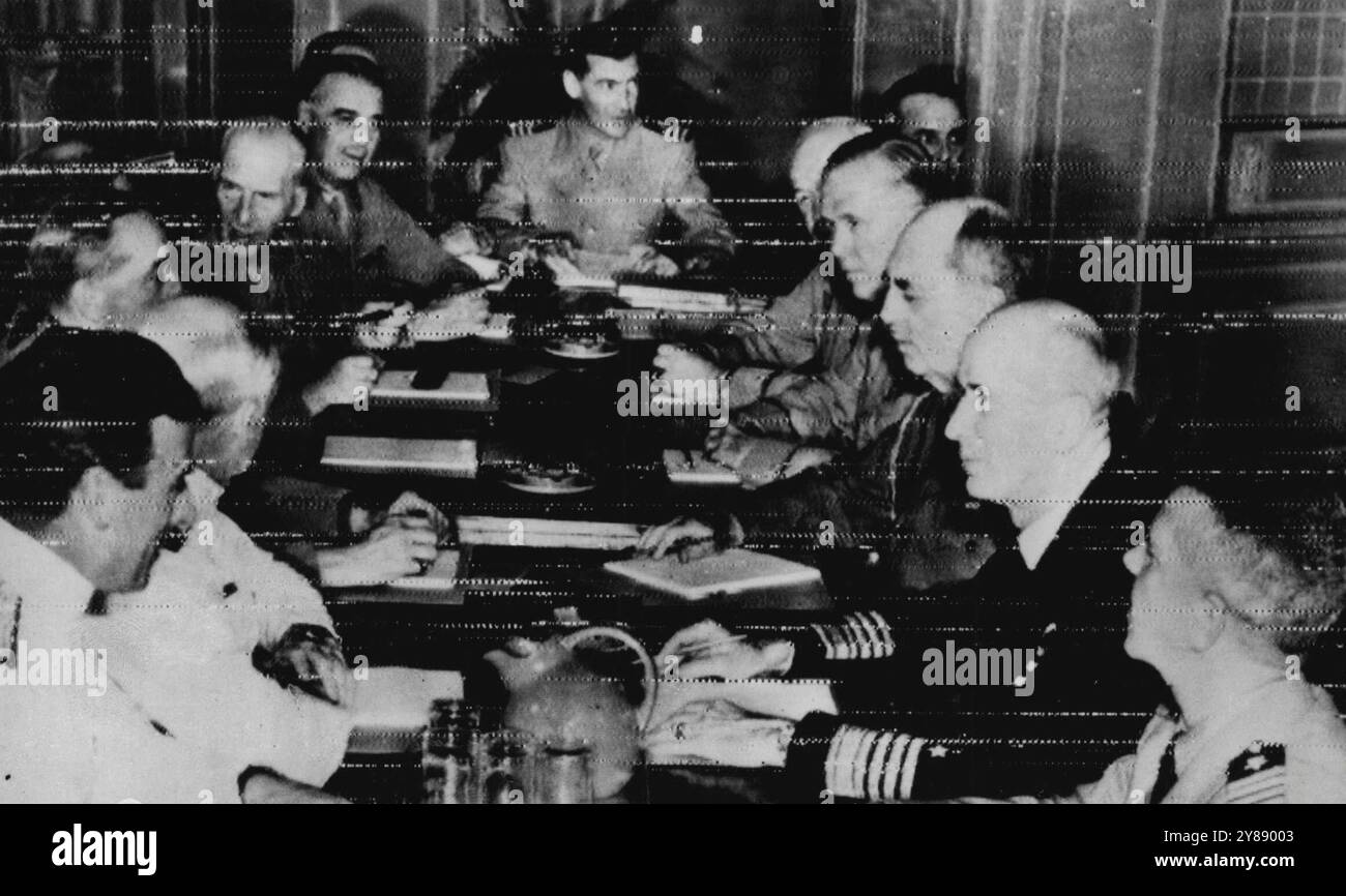 The Combined United States-British Army and Navy staff chief as they conferred at the momentous Quebec, Canada, War Conference ... left to right: Around the table are:- Lord Louis Mountbatten, chief of the British combined operations Admiral Sir Dudley Pound, First British Sea Lord and chief of the Naval Staff; General Sir Adam Brooke, chief of the British Imperial staff; Field Marshal Sir John Dill, Chairman of the British joint staff mission; Gen. Sir Hastings Isway, staff chief minister of Defence; Commander R. Coleridge; Ass't Sec'y British joint mission; Brig. Gen. J. R. Deane, Sec'y of U Stock Photo