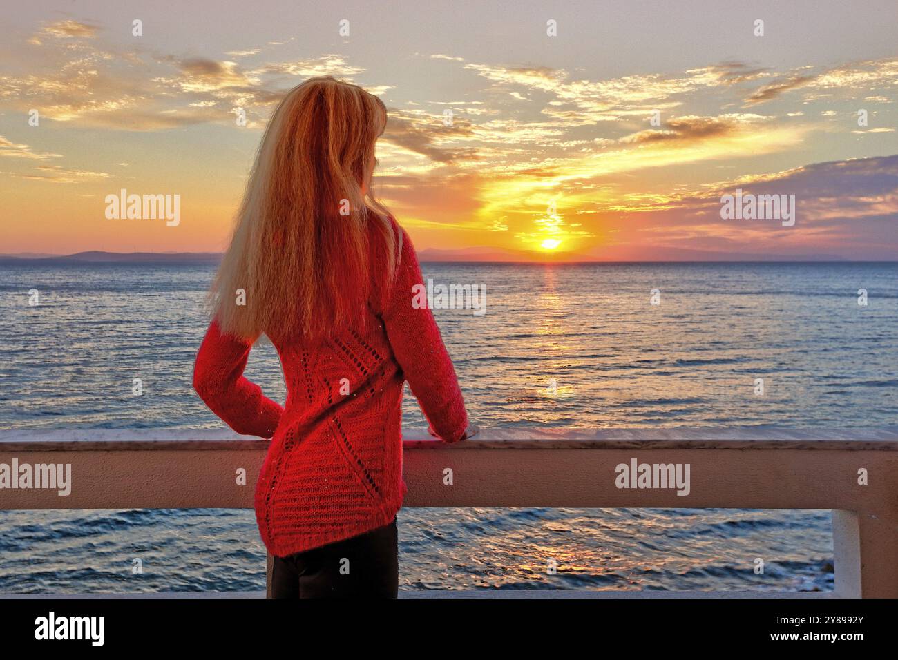 Woman watching sunrise in hi-res stock photography and images - Alamy
