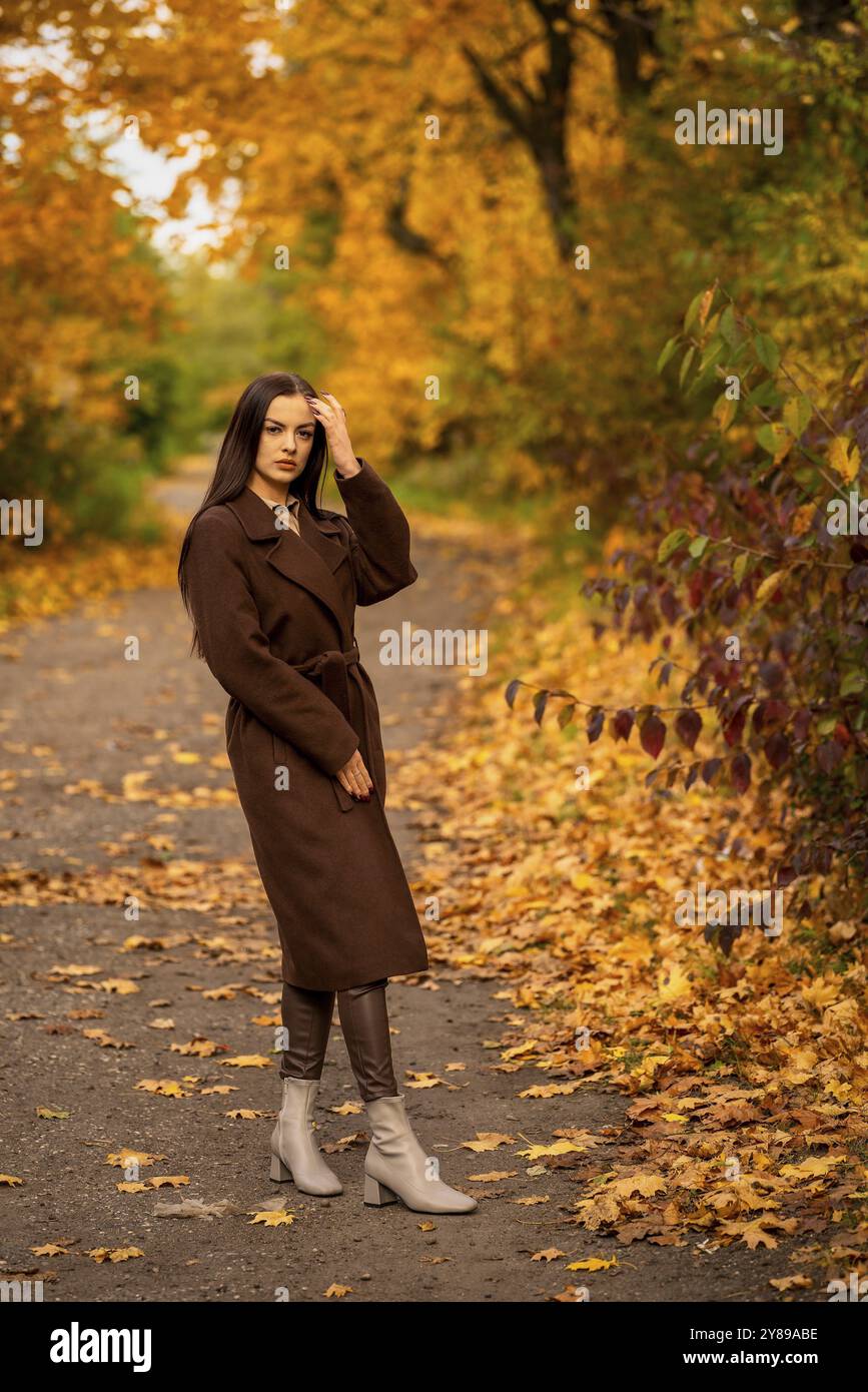Woman in brown coat looks hi-res stock photography and images - Alamy