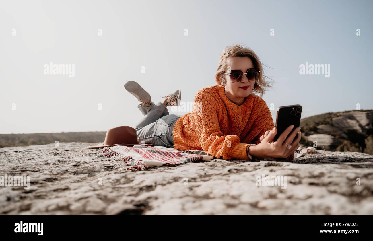 Woman on rocky mountain using hi-res stock photography and images - Alamy