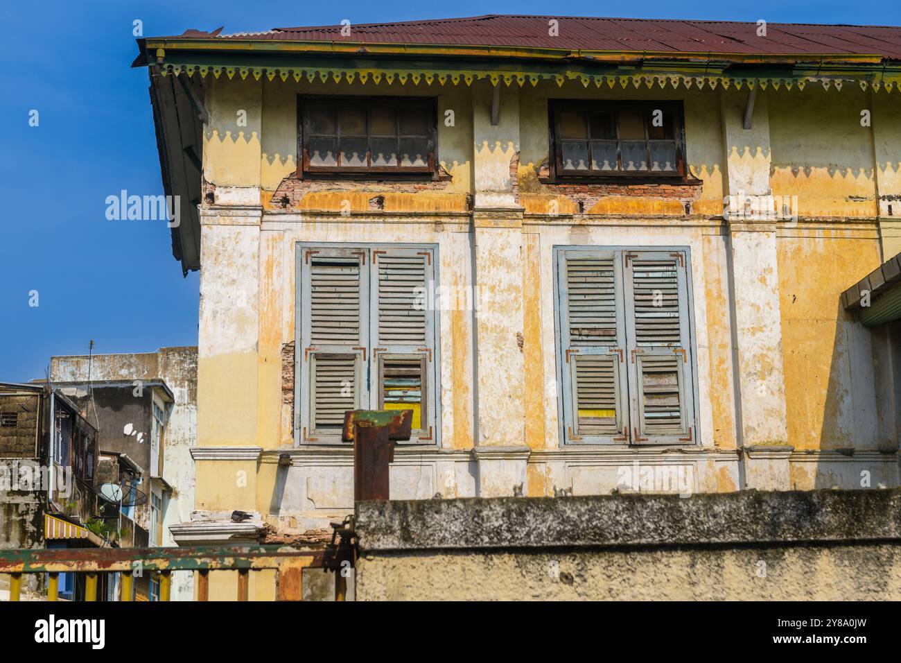 Old building, over 100 years old, located in the old part of Bangkok, can be seen everywhere from public roads, Thailand. Stock Photo