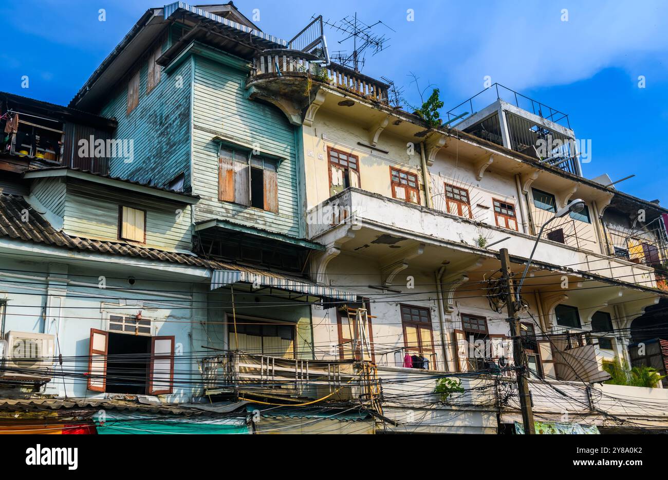 Old building, over 100 years old, located in the old part of Bangkok, can be seen everywhere from public roads, Thailand. Stock Photo