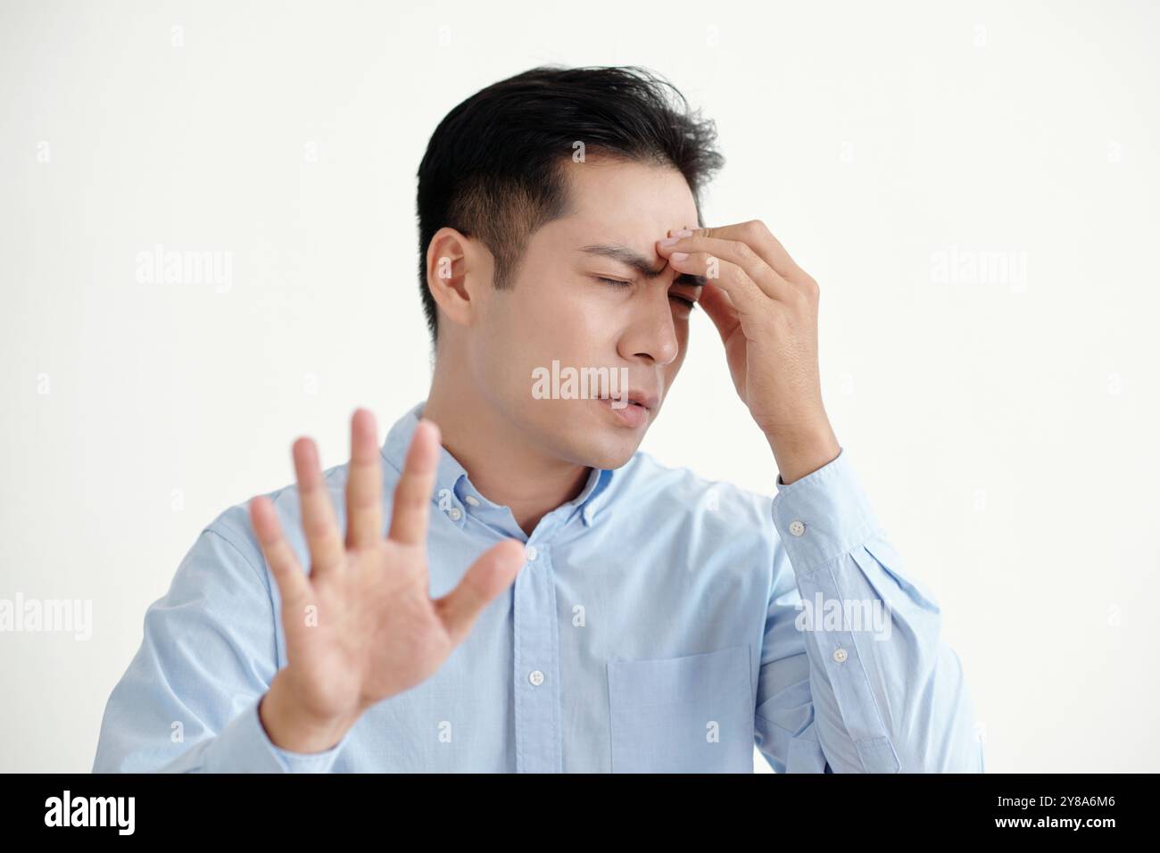 Man Having Headache Above His Problems Stock Photo