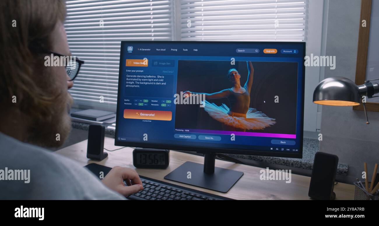 Adult man types prompt in AI video generator software on PC. Artificial ...