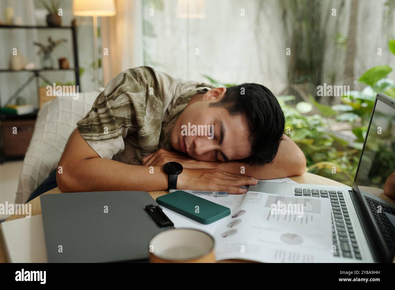 Man Sleeping At His Workplace Stock Photo