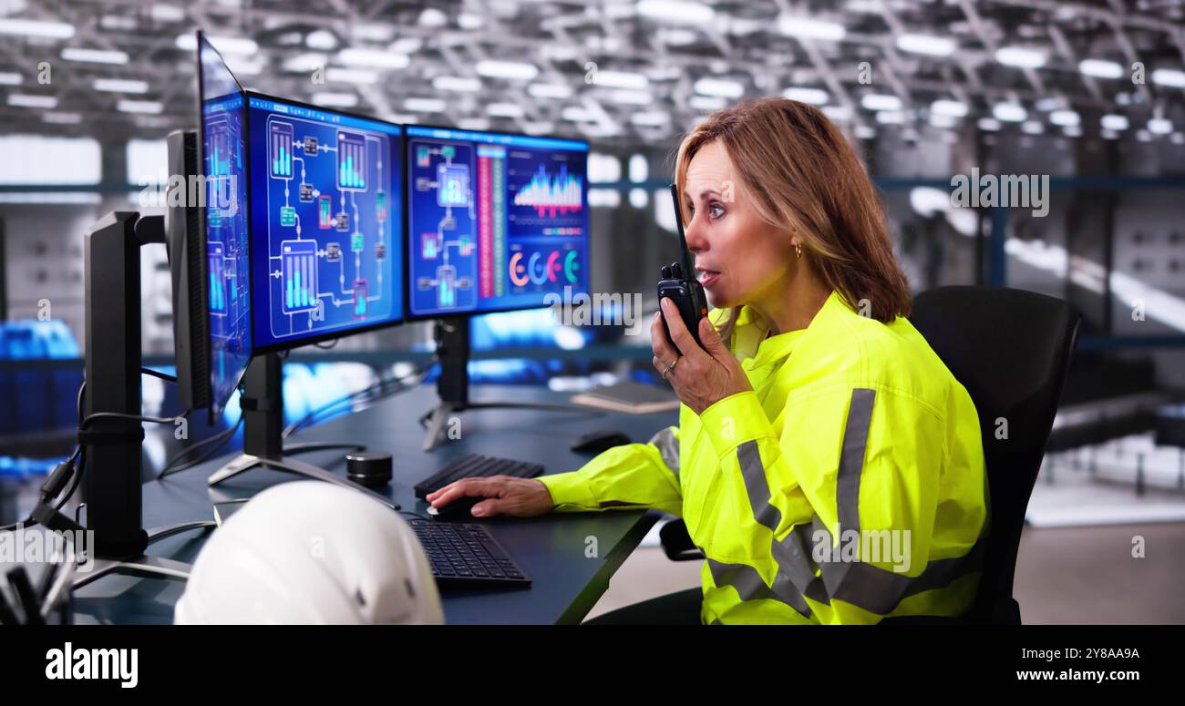 Machine Heating Pipes Control Using Computer. Worker Monitoring Plant Stock Photo