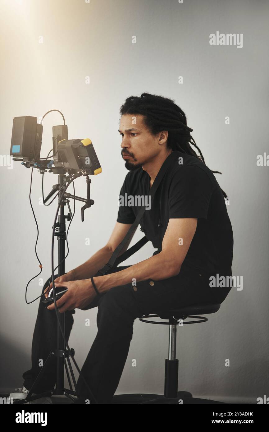 Cameraman behind camera in studio hi-res stock photography and images ...