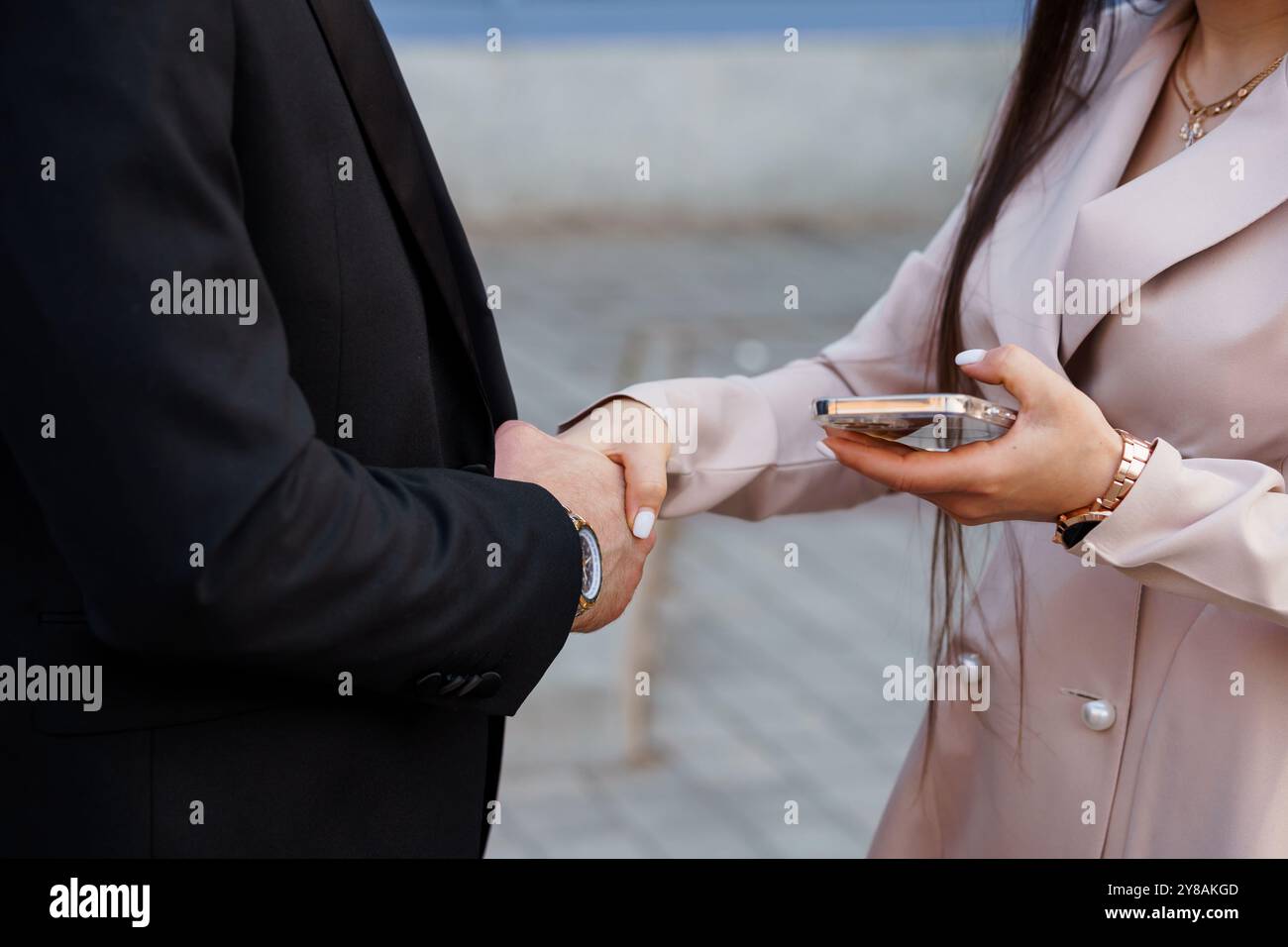 Elegant Business Agreement Between Two Professionals Outdoors. Stock Photo