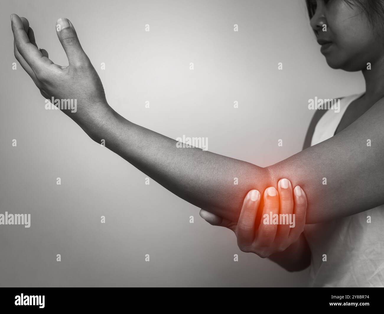Woman with acute pain elbow with arm pain on gray background, Elbow and ...