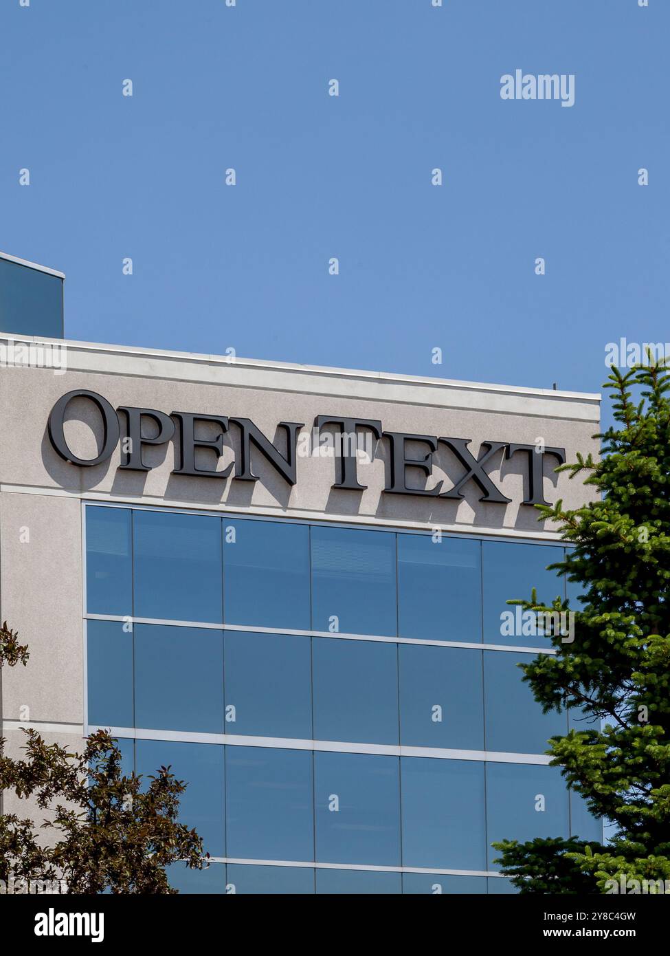 Close up of Open Text sign on their field office building in Richmond Hill, Ontario, Canada Stock Photo