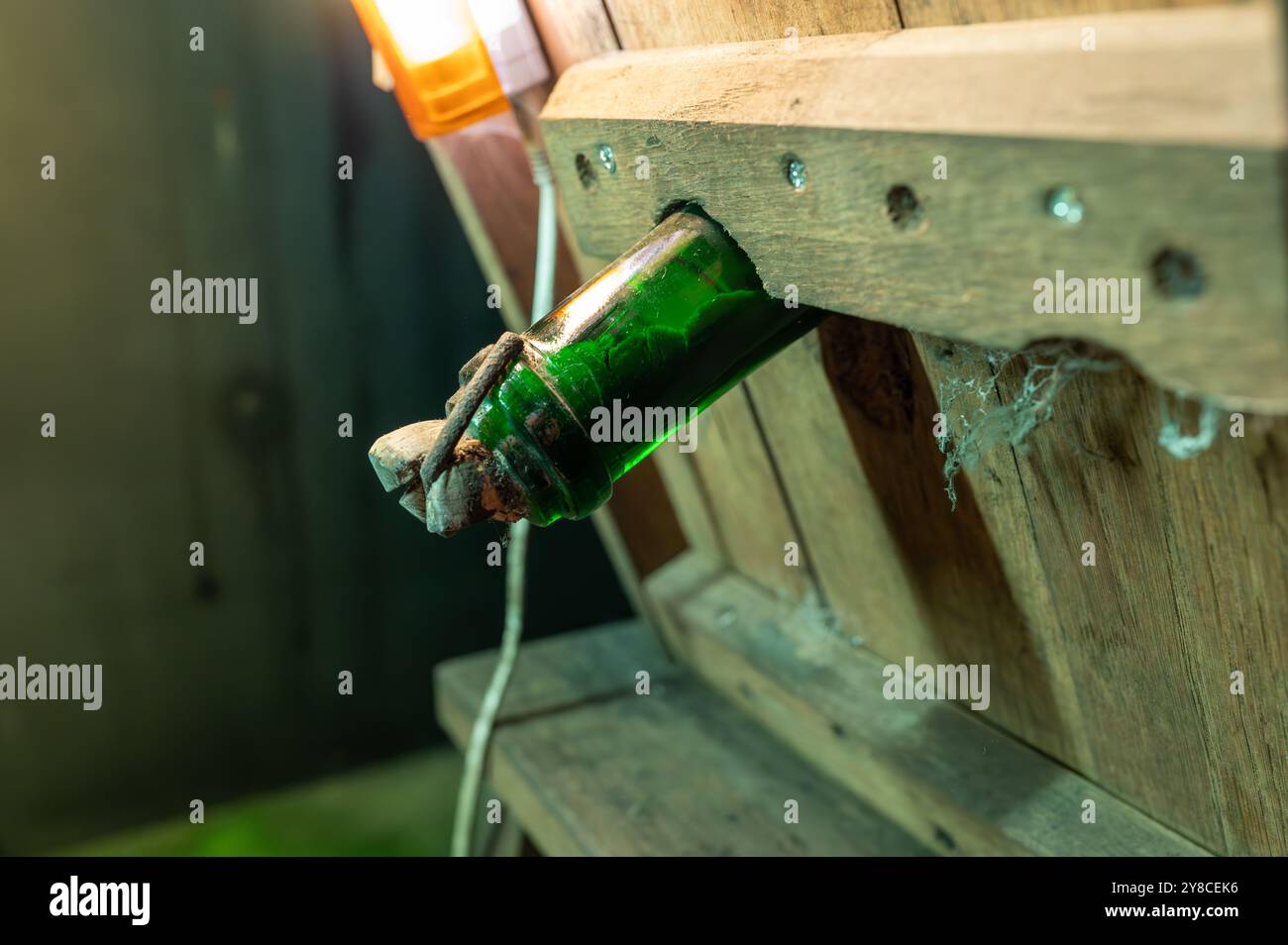 Champagne bottles on pupitre riddling racks in deep and long ...