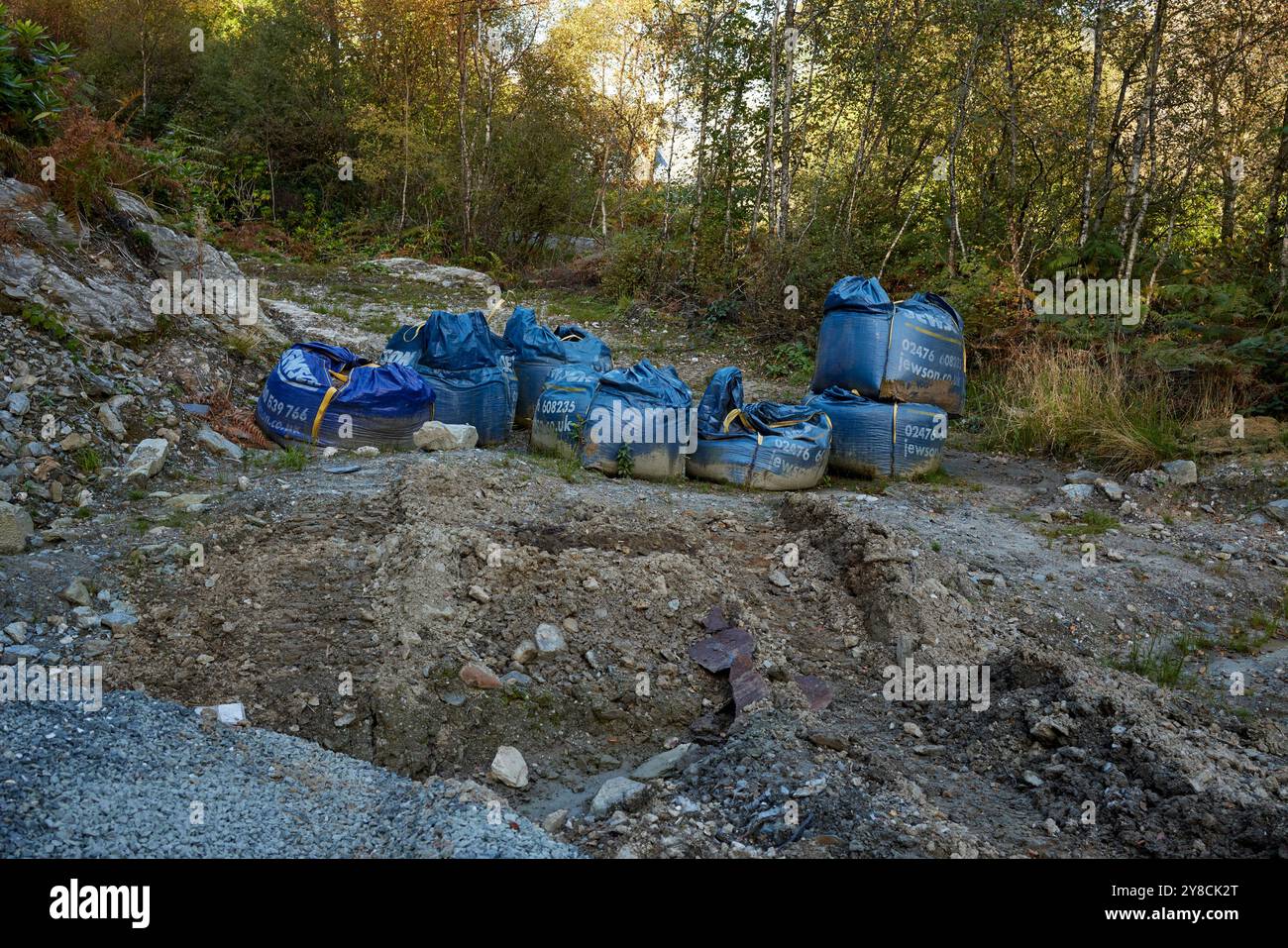 Row of blue building or construction materials on Scottish highland site Stock Photo