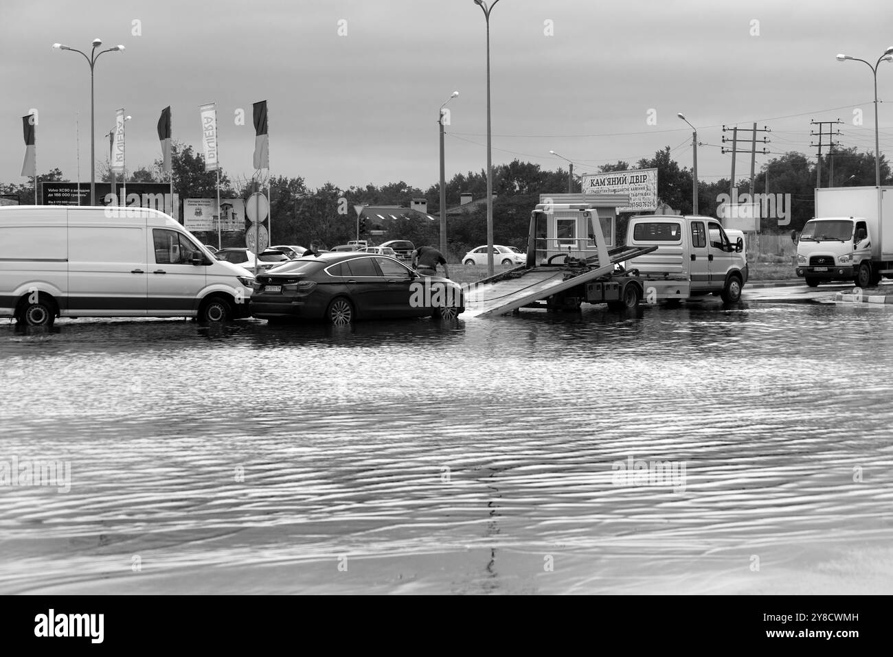 ODESSA, UKRAINE-September 5,2024: After heavy rains, traffic jams formed on roads, cars are doused with water and stall. Cars float in puddles on the Stock Photo