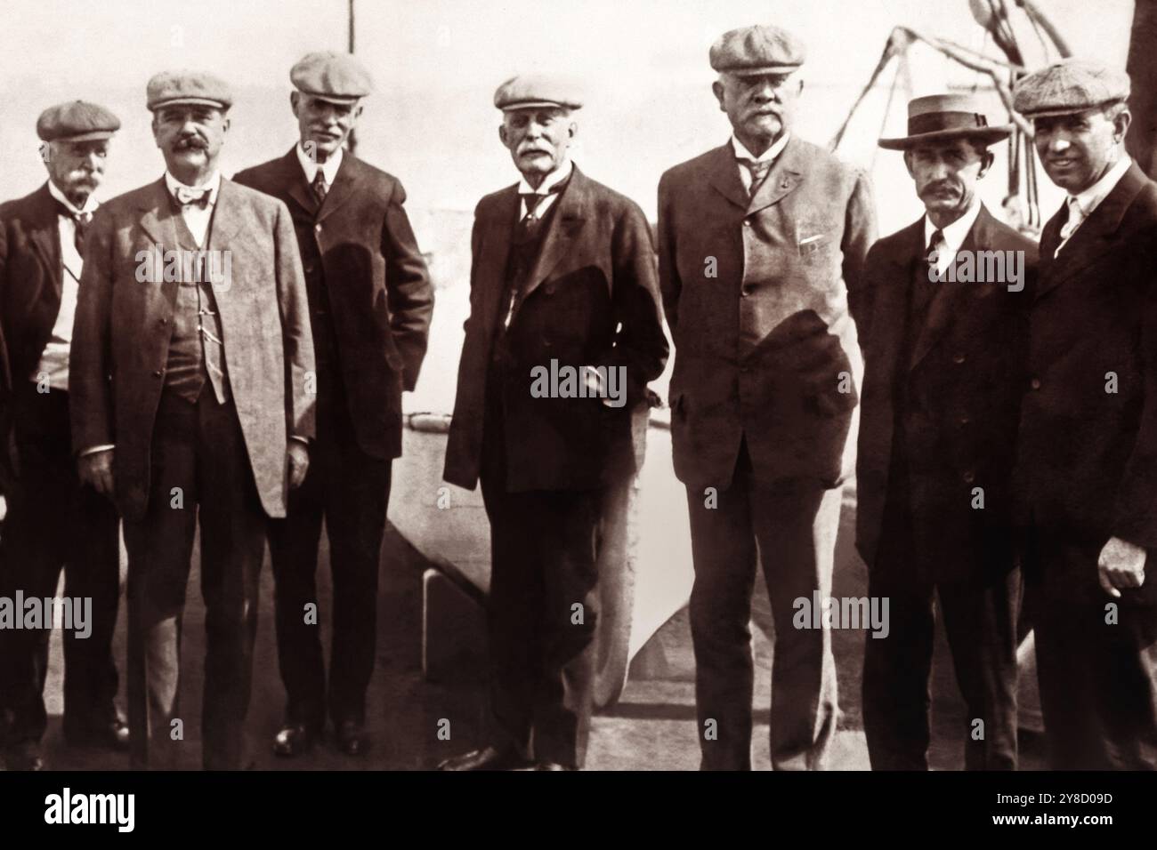 Henry Morrison Flagler (center), railroad and oil tycoon, standing with men from the Florida East Coast Railway for the opening of the Florida Keys Railway, also known as the Over-Sea Railway, connecting the Florida mainland with Key West, on January 22, 1912. (USA) Stock Photo