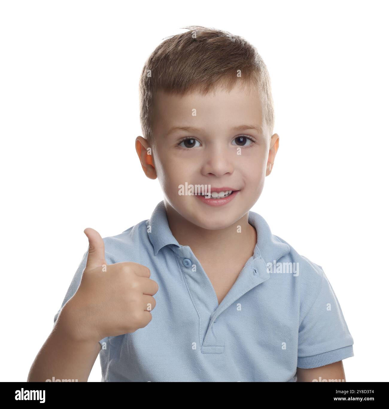 Cute little boy showing thumbs up on white background Stock Photo - Alamy