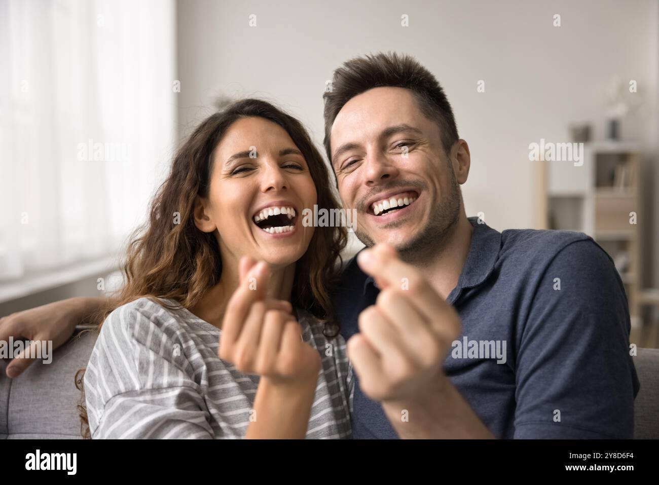 Cheerful married couple showing hi-res stock photography and images - Alamy