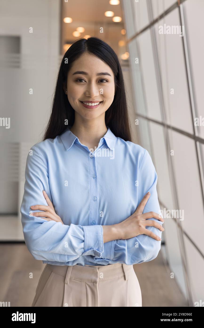 Happy beautiful Asian business woman vertical portrait Stock Photo - Alamy