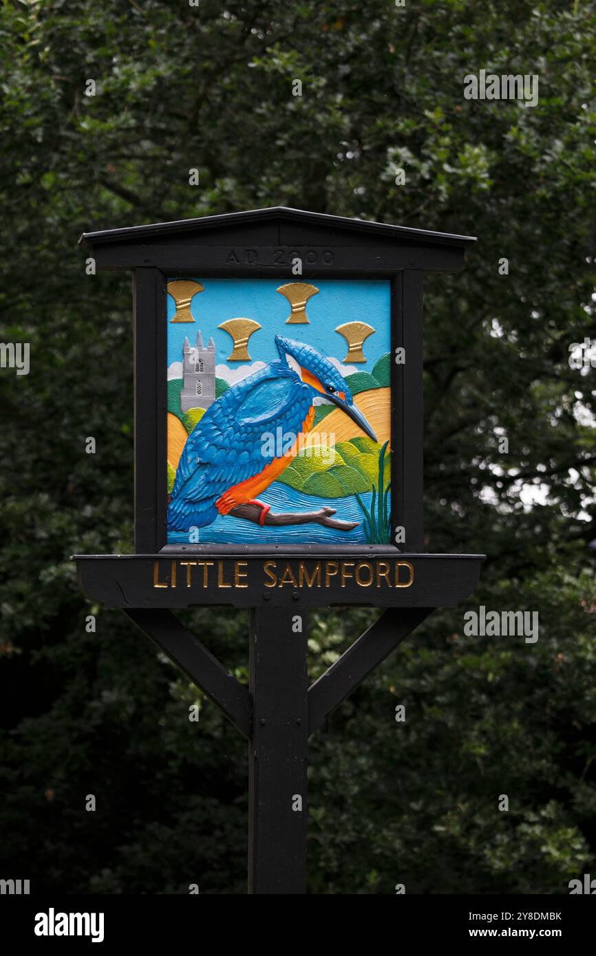 Little Sampford village sign showing a Kingfisher, wheatsheafs and local church set in a country scene. Essex, England, UK Stock Photo