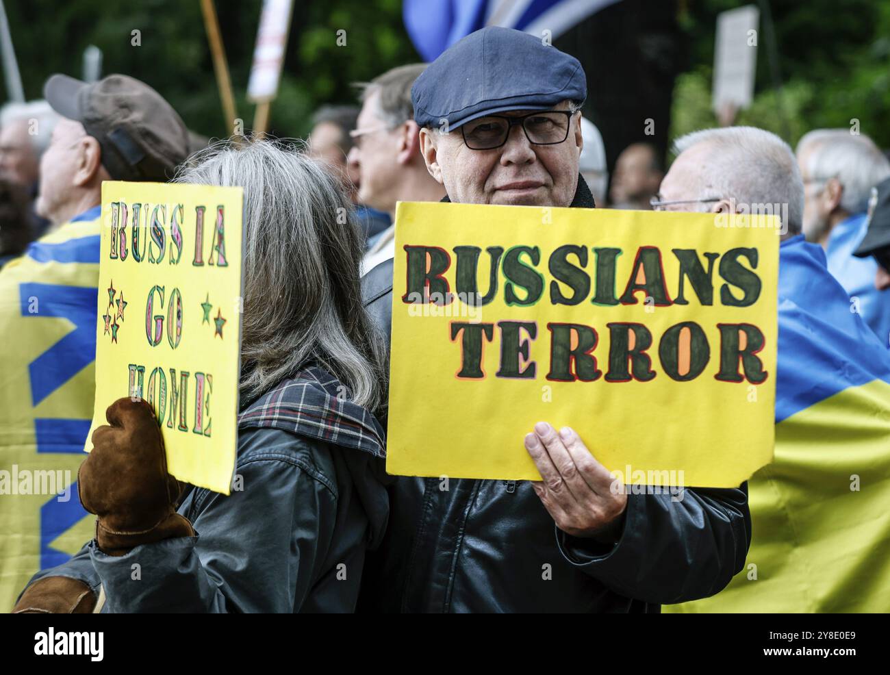 Ukrainians holding placards with the slogan Russia go home at the counter-demonstration Your peace is our death sentence, Berlin, Berlin, Berlin, Germ Stock Photo