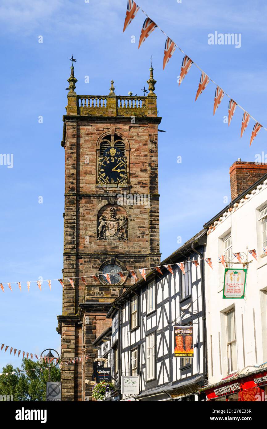 Whitchurch, Shropshire, UK - September 16, 2024; View along Whitchurch High Street with Union Jack bunting to St Alkmunds Church Stock Photo